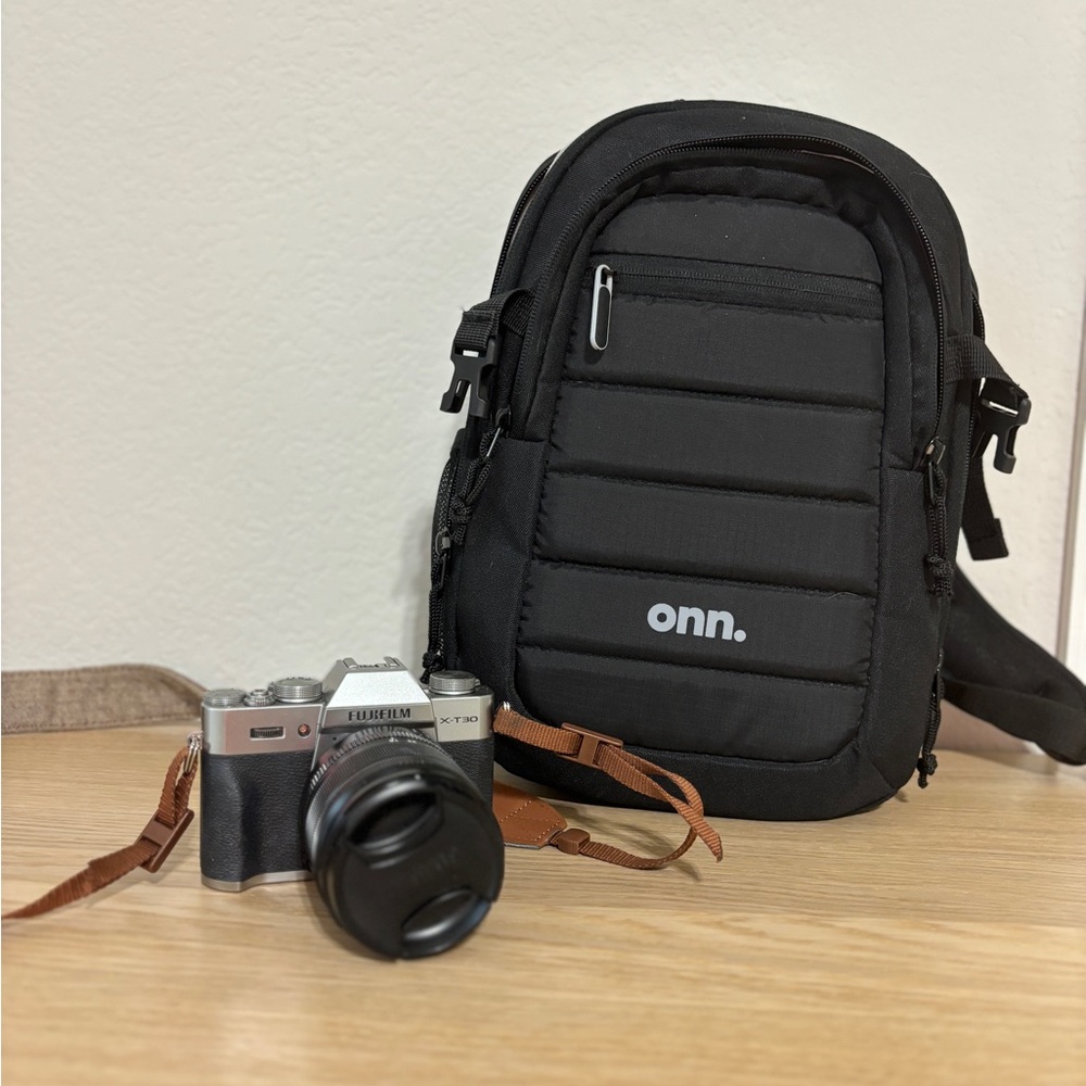 Fujifilm XT30 mirrorless camera with lens and camera bag